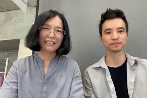 Interlit's two co-founders seated side by side